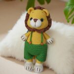 Lion in Blue, Green and Red Shorts by Myrtilus