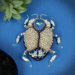 Myrtilus Moonlit Wing – Handmade Celestial White Bug Brooch