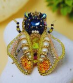 Myrtilus Golden Crest – Handmade Radiant Bug Brooch