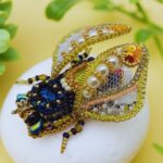 Myrtilus Golden Crest – Handmade Radiant Bug Brooch