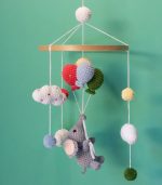 Handmade Crochet Elephant Baby Mobile by Myrtilus—crafted from 100% cotton to soothe and delight. A soft, charming nursery décor and perfect baby gift.
