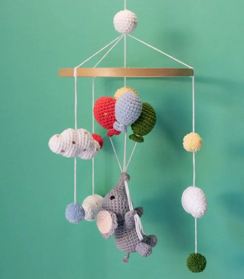 Handmade Crochet Elephant Baby Mobile by Myrtilus—crafted from 100% cotton to soothe and delight. A soft, charming nursery décor and perfect baby gift.