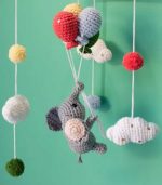 Handmade Crochet Elephant Baby Mobile by Myrtilus—crafted from 100% cotton to soothe and delight. A soft, charming nursery décor and perfect baby gift.