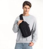 The OZUKO 9565 is a tactical-style EDC sling bag with a waterproof hard shell, organized storage, and tripod holder—built for travel, business, and creative use on the go.